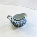 Her Good Eye blue and white porcelain creamer pitcher with floral and phoenix motifs in Chinoiserie style.