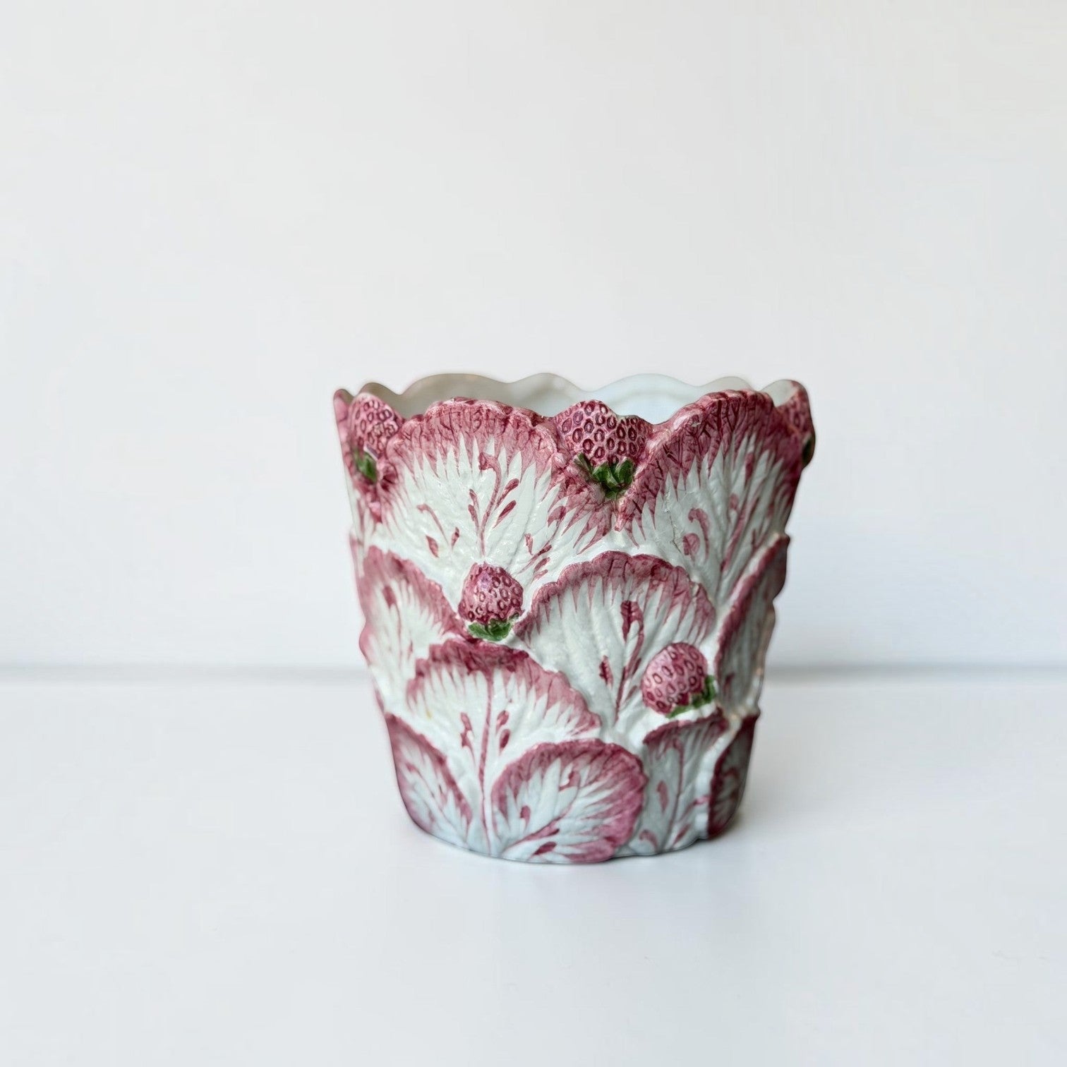 Her Good Eye ceramic planter featuring a vintage majolica-style relief of scalloped leaves and hand-painted strawberries.