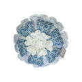 Her Good Eye decorative floral throw pillow with layered blue and white fabric petals in a cottage-core style.