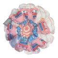 Her Good Eye handmade flower throw pillow with pink typewriter print, blue floral fabric, and a crocheted center.