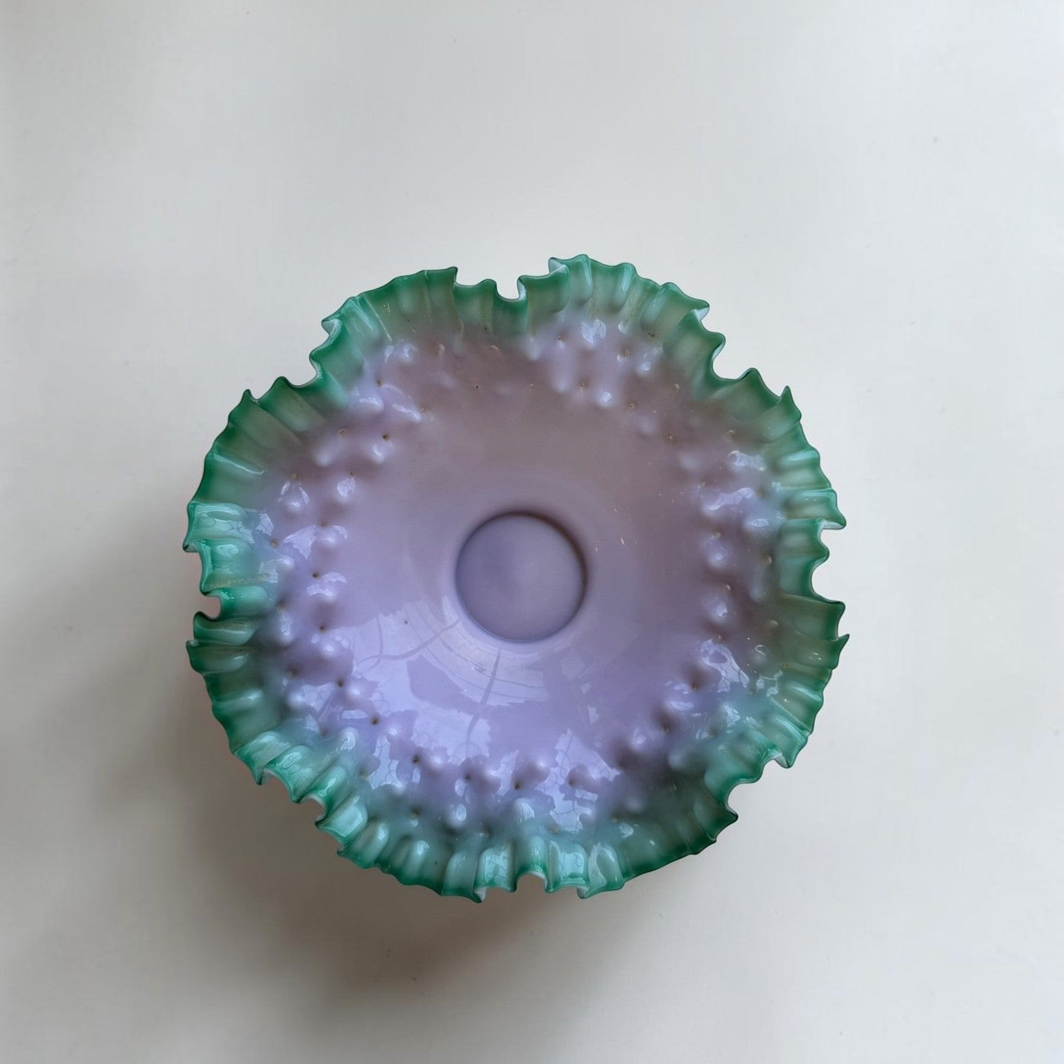 Her Good Eye vintage hobnail glass bowl with a lavender center and vibrant green ruffled edge in an ombre design.