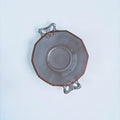 Her Good Eye vintage pink pressed glass serving bowl with an octagonal shape and two arched handles, top view.