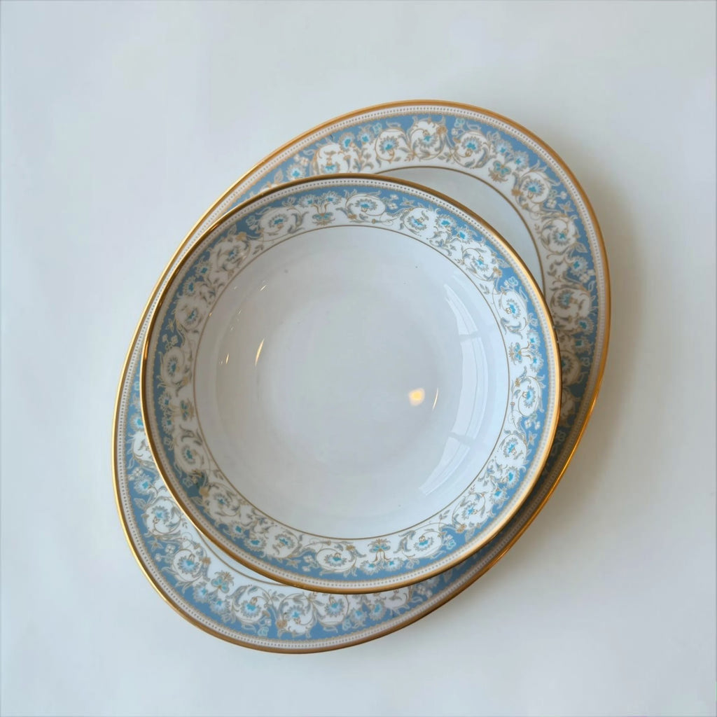 Her Good Eye decorative porcelain serving bowl with blue floral pattern and gold rim. Ideal for serving dishes.