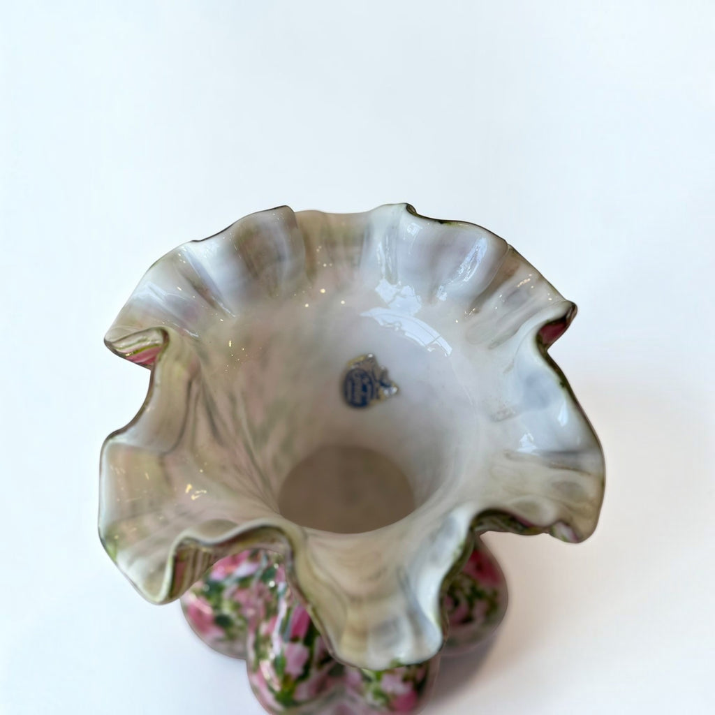 Her Good Eye hand blown glass vase with a ruffled edge, featuring pink and green speckled floral patterns.