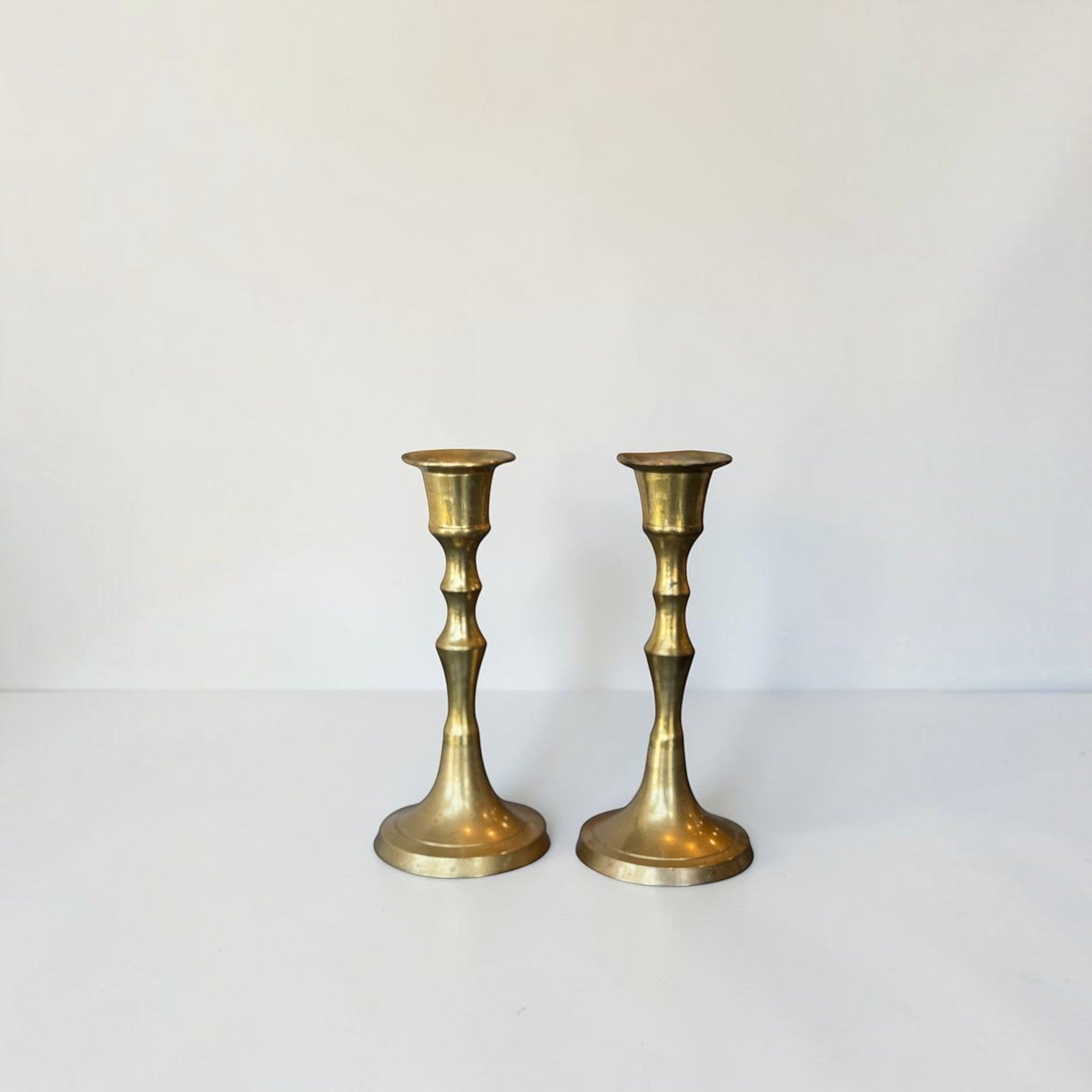 Her Good Eye vintage brass taper candle holder set with a polished golden finish and classic tapered stems.