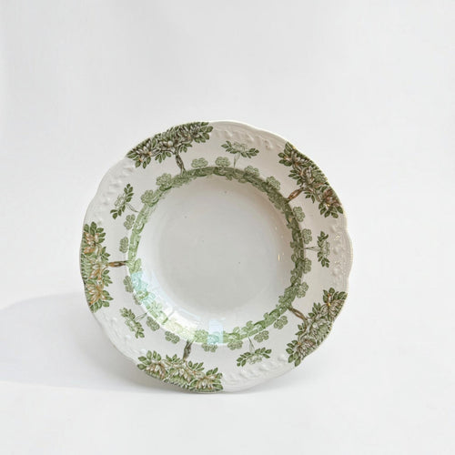 Her Good Eye vintage ceramic serving bowl with sage green and brown botanical tree pattern and scalloped embossed edge.