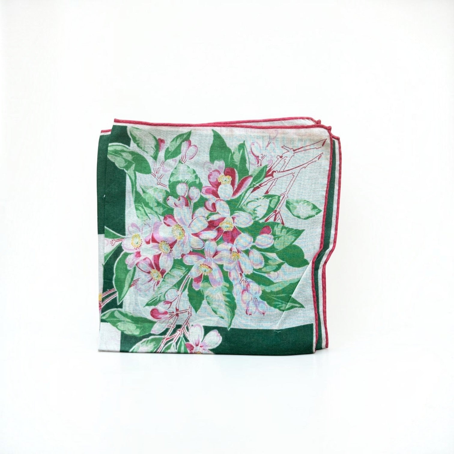 Her Good Eye vintage floral handkerchief with pink blossoms, green leaves, forest green border, and red rolled edge.