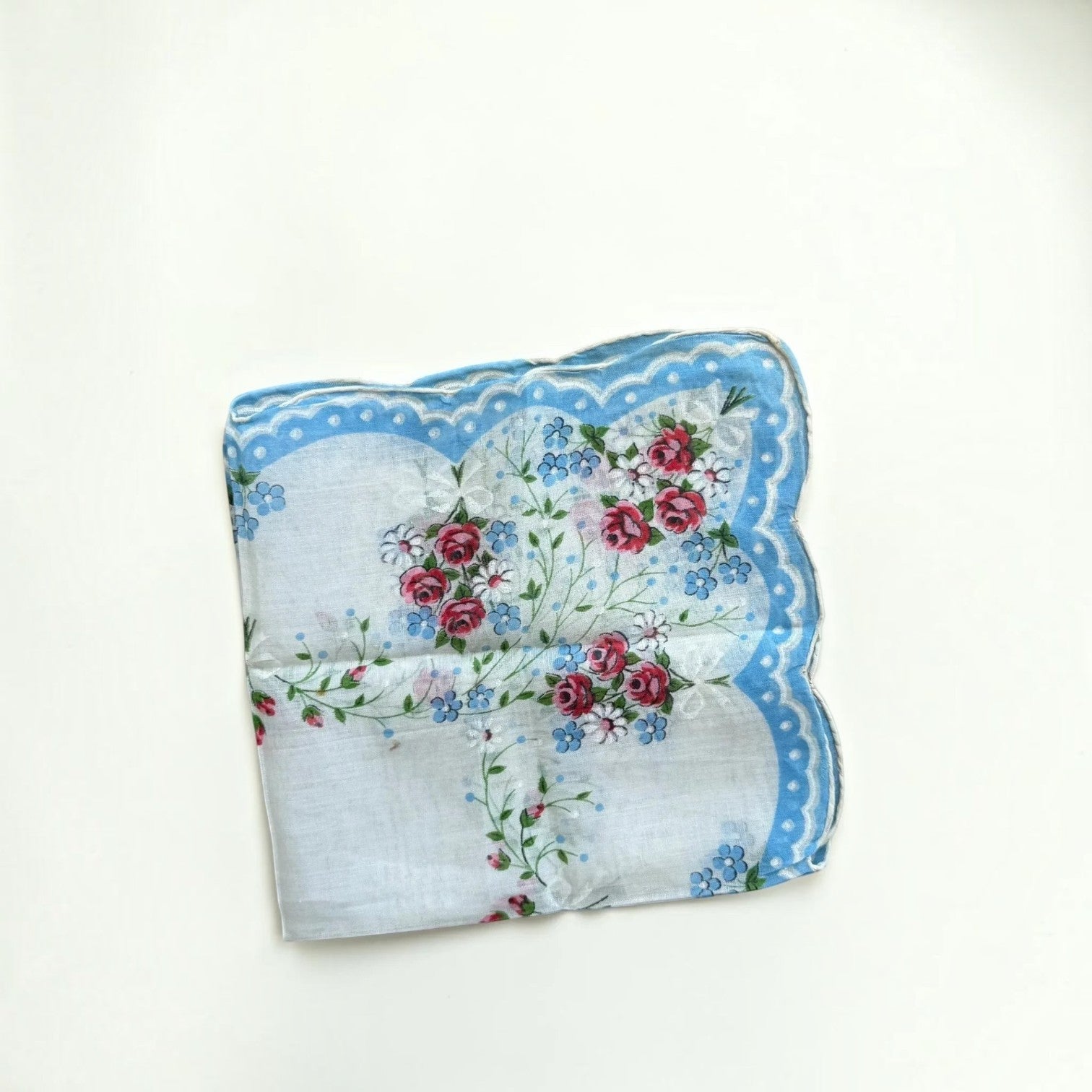 Her Good Eye vintage cotton handkerchief with red roses, blue forget-me-nots, and a scalloped polka-dot blue border.