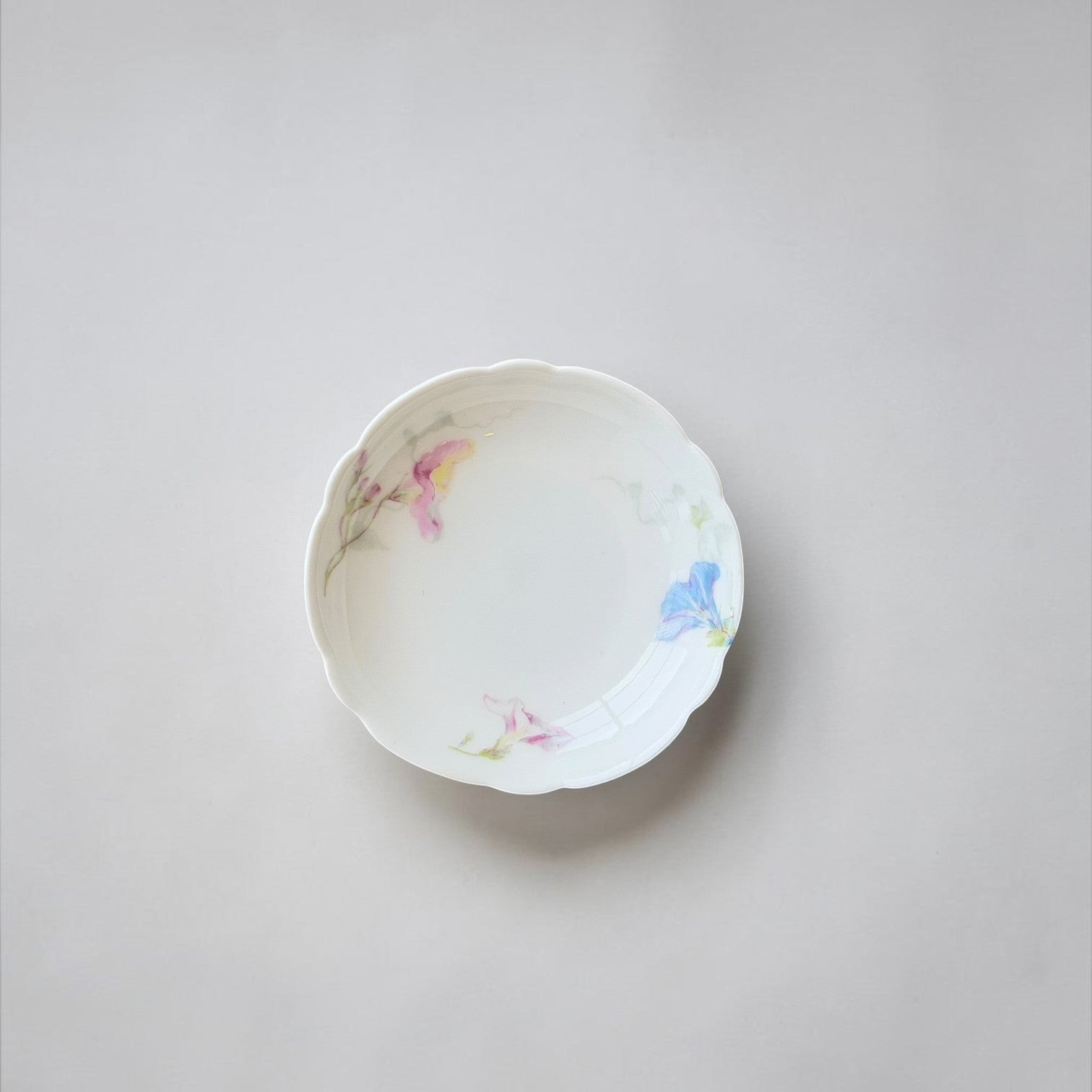 Her Good Eye vintage porcelain serving dish with scalloped edges and hand-painted pink and blue floral motifs.