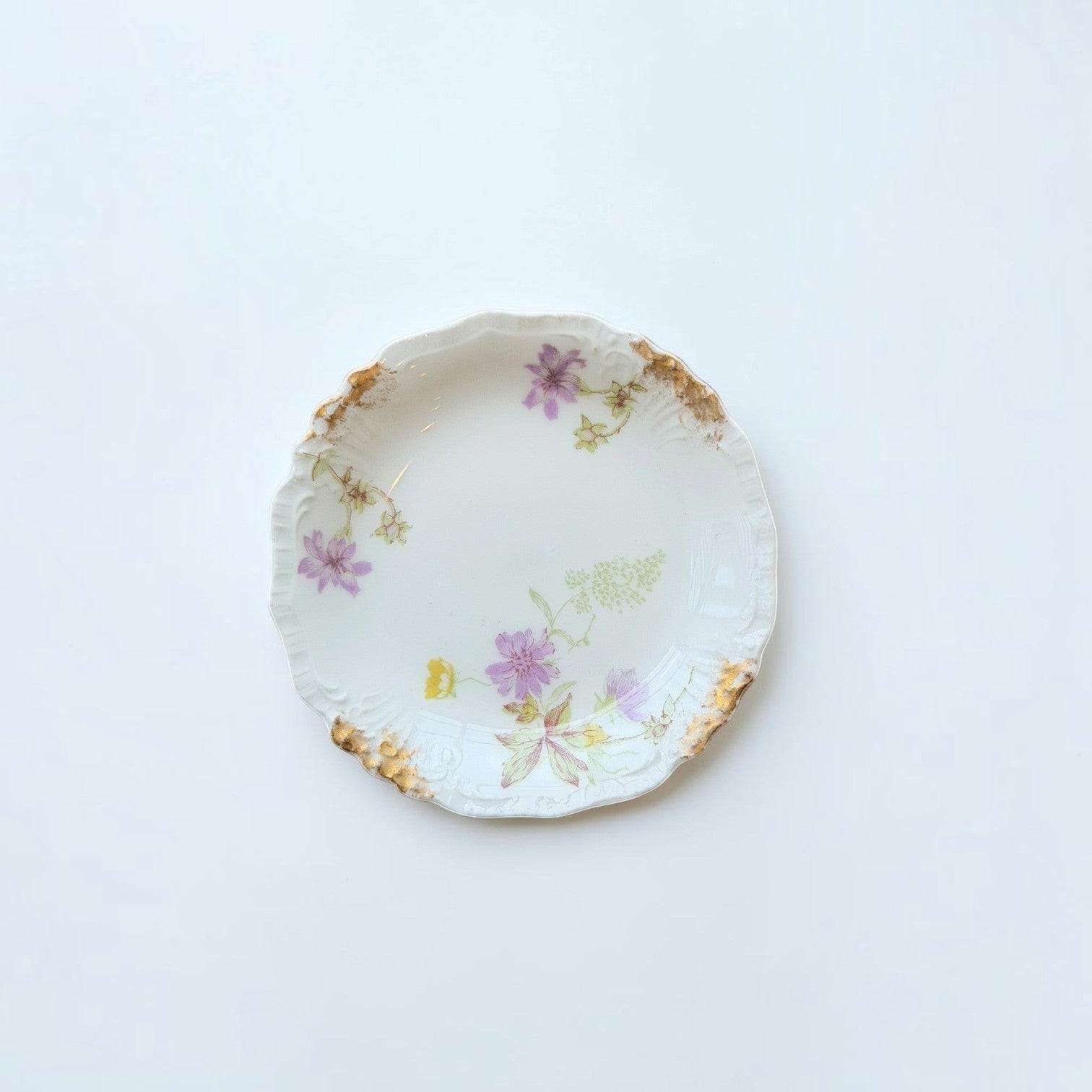 Her Good Eye vintage porcelain side plate with pastel floral motifs, scalloped edges, and hand-painted gold leaf trim.